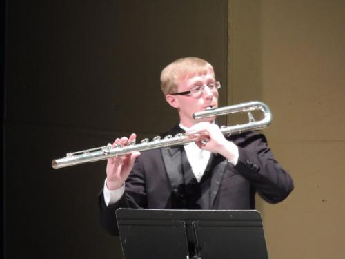 Trey Sims playing bass flute.