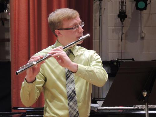 Trey playing at a flute studio recital.